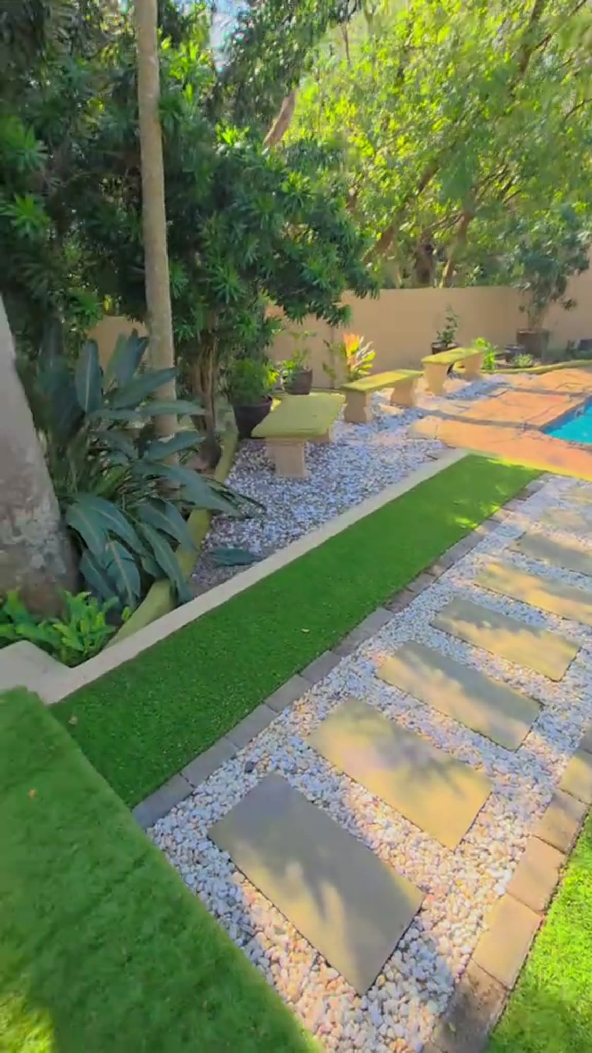 Finished landscaped garden with lawn strip and stepping slabs